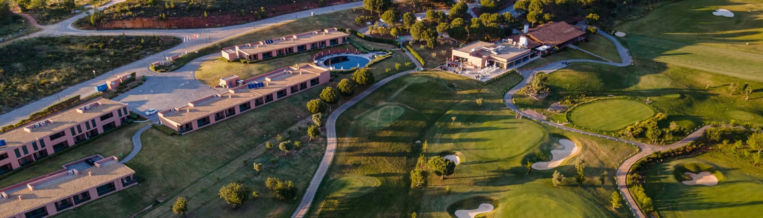 nau hotels and resorts an aerial view of a morgado golf course and a resort