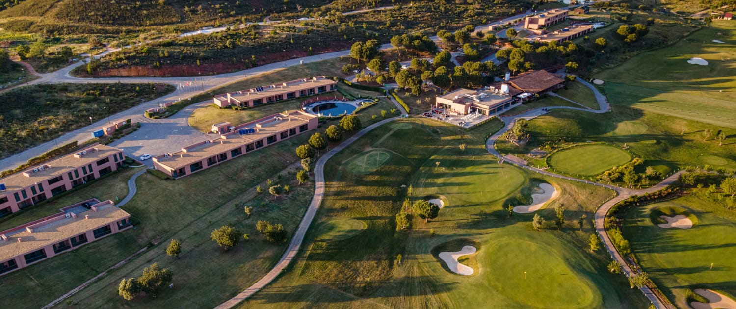 nau hotels and resorts an aerial view of a morgado golf course and a resort